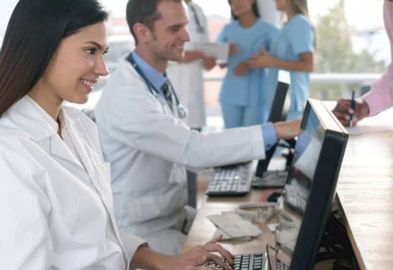 Medical Professional looking at Patients data using RIS